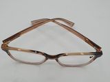 a pair of glasses sitting on top of a white surface