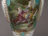 a vase with a picture of a man and a woman on it