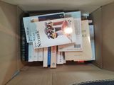a box full of books sitting on top of a table
