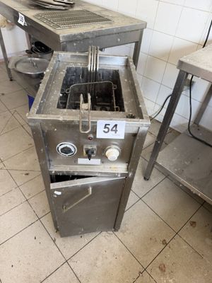 an image of a kitchen with a stove and a sink