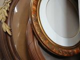 many plates in a box with a mirror on top of them