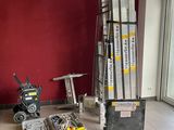 a room that has a lot of boxes and tools on the floor