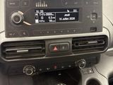 a car dashboard with a car radio in the center of it