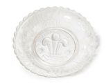 a white plate with a design on it on a white surface