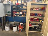 a storage area with a lot of tools on the shelves