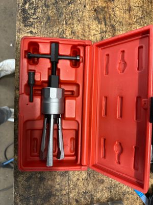 a red box with tools in it on a table