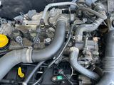 a picture of a car engine with its hood open
