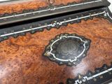 a wooden desk with a black and white design on it