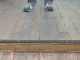 a person standing in front of a large mirror