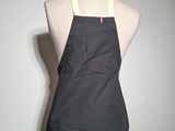 an apron on a mannequin with a blue and white stripe