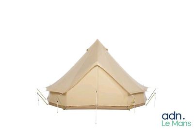a large beige tent sitting on top of a white floor