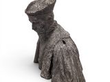 an image of a statue of a woman with a hat on her head
