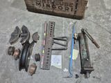 a box of tools sitting on the floor next to a pair of wrenes