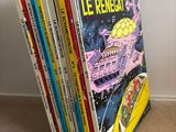 a stack of children ' s books sitting on the floor