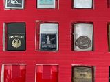 a lot of lighters that are sitting on a red surface