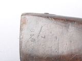 a close up of a metal object on a white surface
