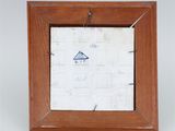 an old picture frame with a drawing of a boat on it