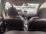 two seats in the back of a car with a steering wheel