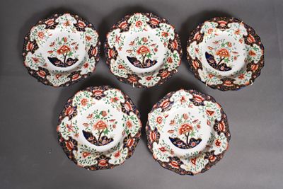 six plates and cups with floral designs on them on a table
