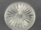 an image of a clear glass plate with a flower design on it
