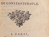 an old book with black writing on it sitting on top of a table