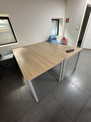 a table with a remote control on it in a room