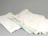 a pile of white lace on top of a table