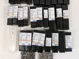 a lot of different types of screws in a box