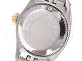 a close up of a watch on a white surface with a white background