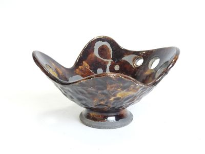 bowl shaped like a flower with holes in the center