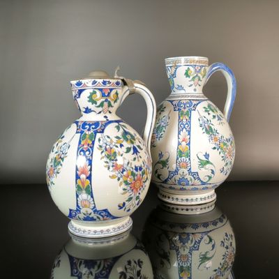 two vases that are sitting on a table