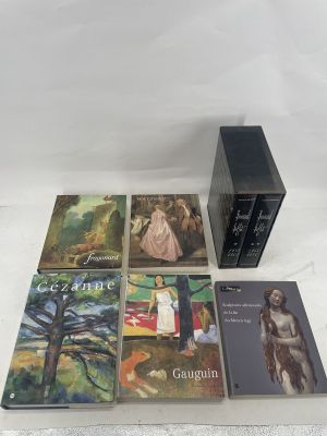 a set of four books on a white surface with a white background