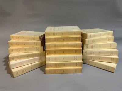 several books stacked on top of each other on a table