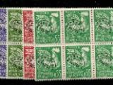 a green, purple and red stamp on a black background