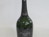 a bottle of wine that is sitting on a table