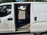 a white van that is parked in the parking lot