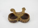pair of wooden bowls with two birds on them sitting on a white surface