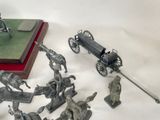 a lot of figurines that are sitting on a table