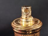 an image of a close up shot of a gold colored fire hydrant