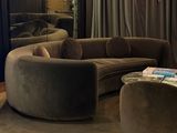 a living room with a couch, chair, and coffee table in it
