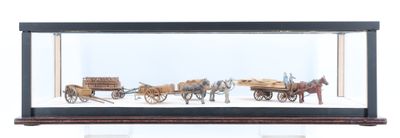 une maquette d'une calèche tirée par des chevaux