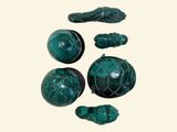 a picture of a group of green stone objects