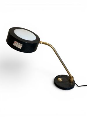 a close up of a lamp on a table with a white background