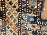 a close up picture of a woman ' s dress with a pattern on it
