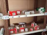 a shelf with many boxes and packages on it