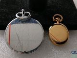 two different types of pocket watches on display