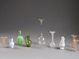 a lot of glass vases that are sitting on a table