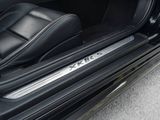 a close up of a car door sill with the door handle open