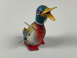 a toy duck that is sitting on a table