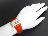 an image of a woman ' s wrist with a watch on it